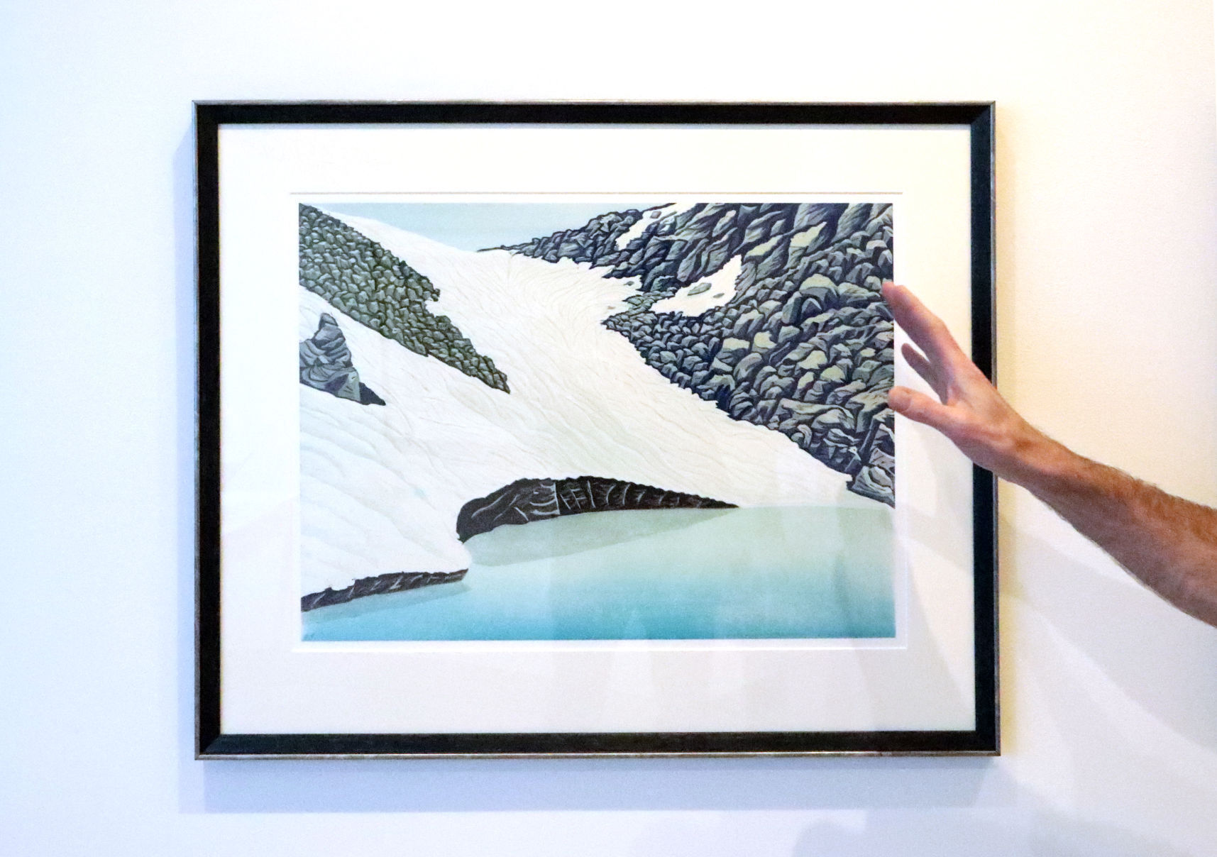 Bruce Crownover pointing at print